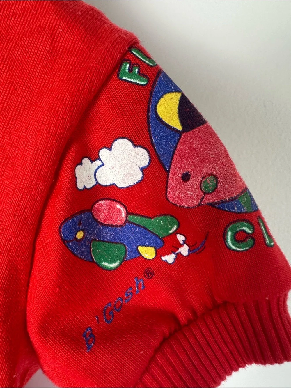 OshKosh B'gosh White Overalls with Colorful Airplane Print and Red Accents